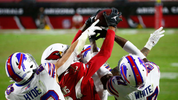 Arizona Cardinals DeAndre Hopkins (10) catches a game-winning touchdown catch over Bill's Tre'Davious White (27) and Micah Hyde (23) with two seconds left in the fourth quarter at State Farm Stadium in Glendale, Ariz. on Nov. 15, 2020.